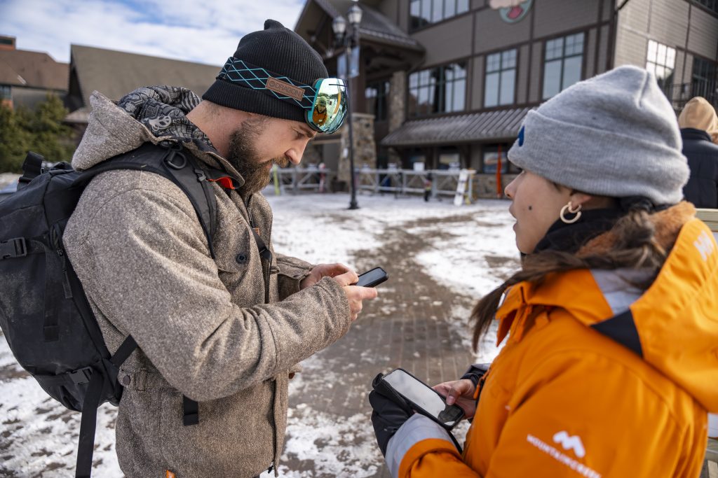 A Mountain Creek employee checks in a guest with SnowCloud.